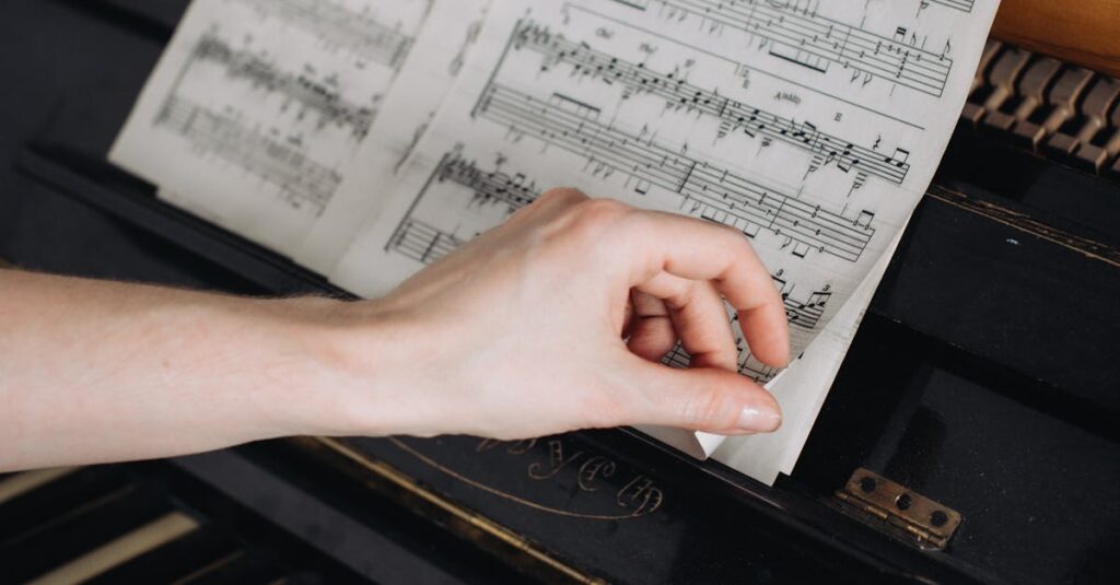 Close-up of a woman's hands on a piano, turning sheet music pages, capturing musical focus.